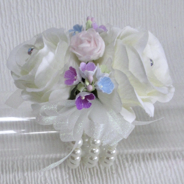 Pale Ivory Roses with, pink, blue & Lilac forget me not Wrist Corsage